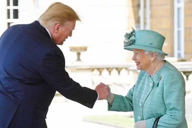 Queen Elizabeth II greets US President Donald Trump as he arrives for the Ceremonial Welcome at Buckingham Palace, London. Photo: Victoria Jones/PA Wire