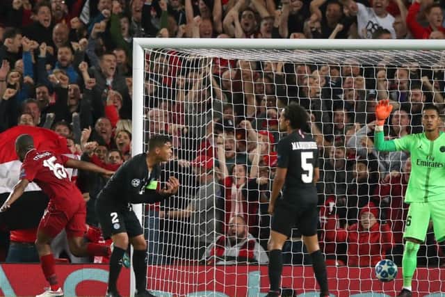 Daniel Sturridge, left, turns away after scoring  Liverpools opening goal in the 3-2 defeat of PSG last September. Picture: PA.