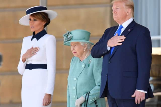 Queen Elizabeth II stands with US President Donald Trump and US First Lady Melania Trump.  Photo by Toby Melville - WPA Pool/Getty Images