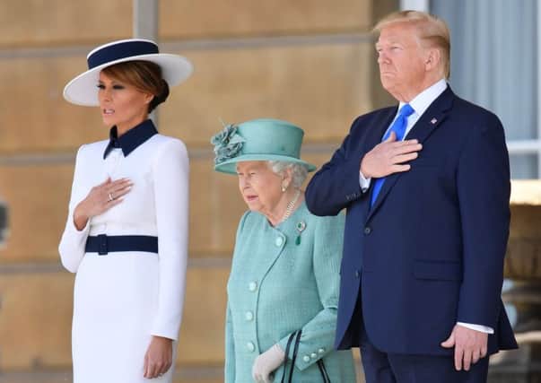 Queen Elizabeth II stands with US President Donald Trump and US First Lady Melania Trump.  Photo by Toby Melville - WPA Pool/Getty Images