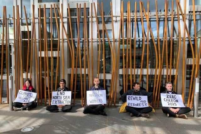 The five protesters outside the Scottish Parliament today