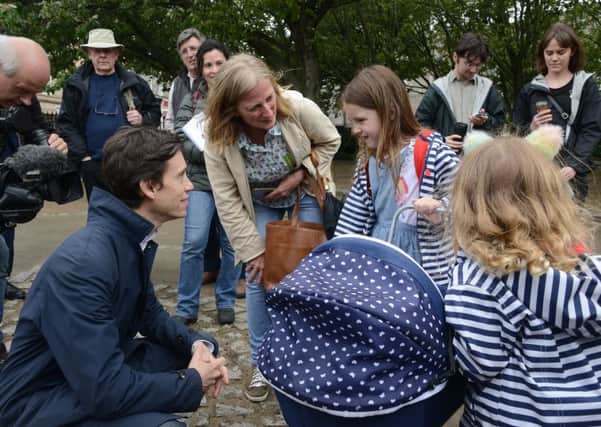 Rory Stewart chats to youngsters in Stockbridge during a leadership campaign visit to Edinburgh. Picture: Jon Savage