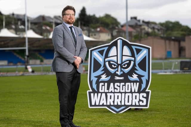 Glasgow Warriors managing director Nathan Mombrys unveils the clubs new badge at Scotstoun. Picture: SNS/SRU.