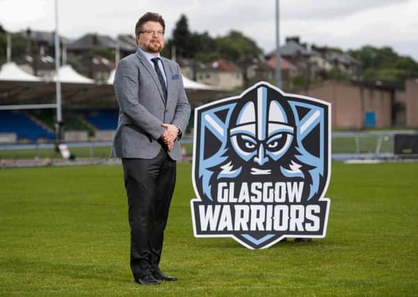 Glasgow Warriors managing director Nathan Mombrys unveils the clubs new badge at Scotstoun. Picture: SNS/SRU.