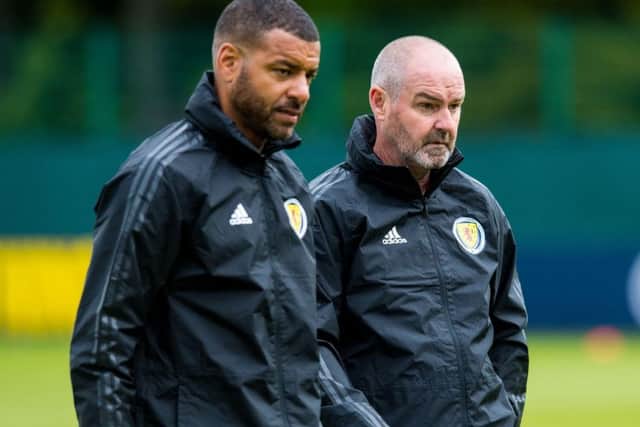 Steven Reid with
Scotland manager Steve Clarke on the training field.