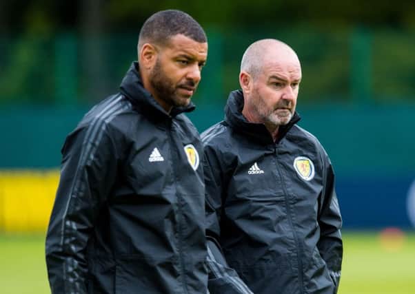 Steven Reid with
Scotland manager Steve Clarke on the training field.