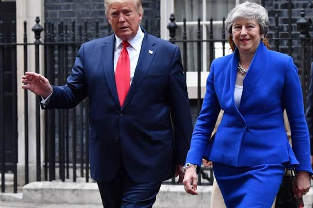 Prime Minister Theresa May and US President Donald Trump leave 10 Downing Street, during the second day of his State Visitt. (Photo by Jeff J Mitchell/Getty Images)
