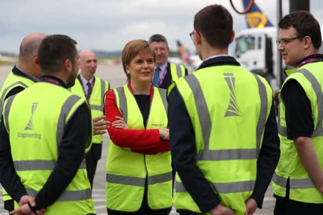 The First Minister received a tour of the terminal from Gordon Dewar, the airport's chief executive.