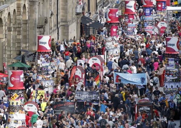 Crowds on Edinburgh's Royal Mile during the Edinburgh Festival Fringe.