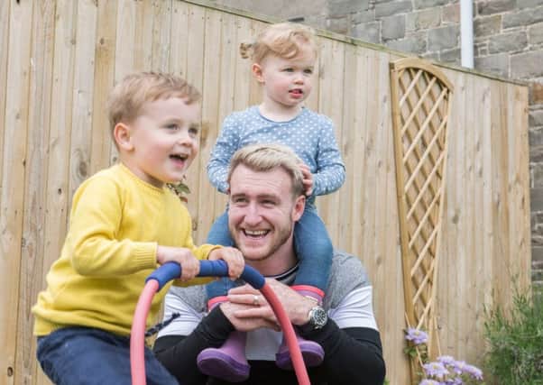 Scotland rugby star Stuart Hogg at home in Hawick with three year old Archie and two year old Olivia. Picture: George Powell