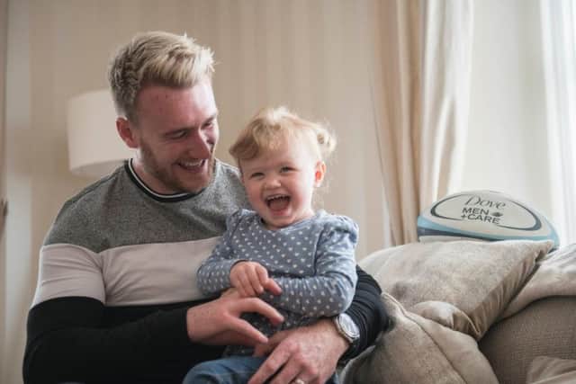 Stuart Hogg with daughter Olivia. The rugby player is a Scottish rugby ambassador for Dove Men+Care, which aims to celebrate strength with care at its core.
Picture: George Powell