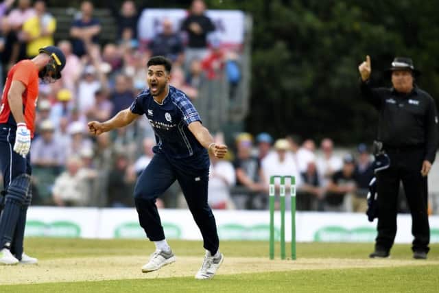 Scotland's Safyaan Sharif celebrates as Scotland beat England by six runs. Picture: Rob Casey/SNS