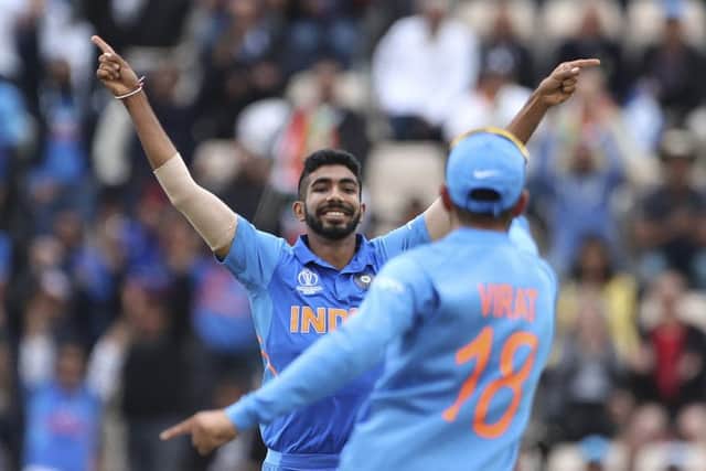 India's Jasprit Bumrah, left, celebrates with captain Virat Kohli after dismissing South Africa's Hashim Amla. Picture: Aijaz Rahi/AP