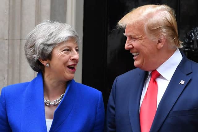 Theresa May with  Donald Trump at  Downing Street, during the second day of his State Visit. Picture: Getty