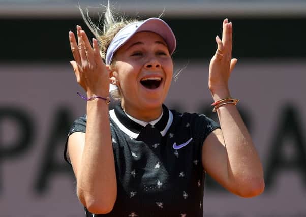 Amanda Anisimova celebrates after her win over Simona Halep. Picture: Christophe Archambault/AFP/Getty