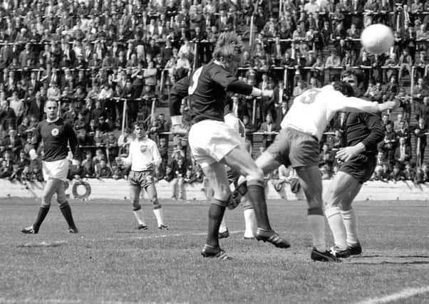 Colin Stein heads home one of his four goals in the 8-0 victory over Cyprus in 1969. Picture: TSPL.