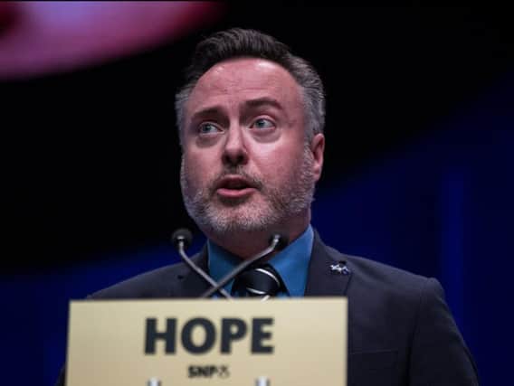 The chairman of the Brexit party has demanded compensation and an apology from SNP MEP Alyn Smith over comments made on Sky News.
