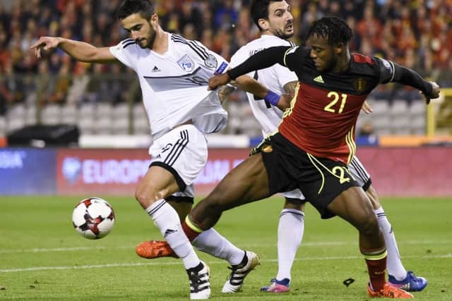 Konstantinos Laifis of Cyprus, left, battles with Belgian forward Michy Batshuayi during a world cup qualifier in Brussels in 2017. Pictuer: John Thys/AFP/Getty