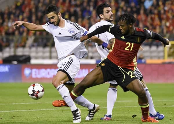 Konstantinos Laifis of Cyprus, left, battles with Belgian forward Michy Batshuayi during a world cup qualifier in Brussels in 2017. Pictuer: John Thys/AFP/Getty
