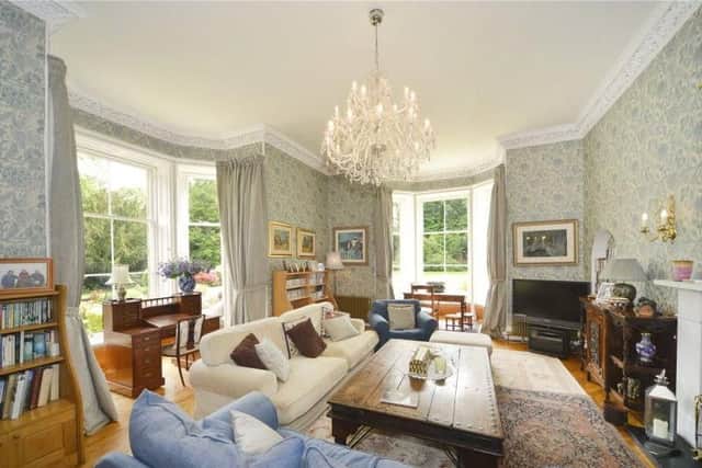 Period features can be seen in the living room, which has south and west facing windows.