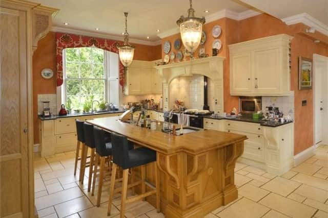 The kitchen is by designers, Clive Christian, and has a gas fired four oven Aga and lots of storage space plus a dining area.