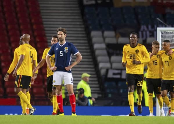 Charlie Mulgrew looks dejected as Scotland go down 4-0 to Belgium at Hmapden. Picture: SNS Group