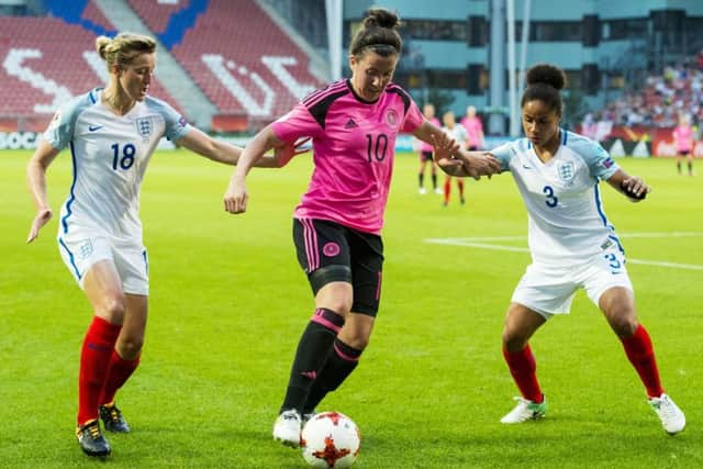 Scotland's Leanne Crichton takes on England's Ellen White (left) and Demi Stokes during Euro 2017. Picture: Paul Devlin/SNS