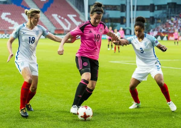 Scotland's Leanne Crichton takes on England's Ellen White (left) and Demi Stokes during Euro 2017. Picture: Paul Devlin/SNS
