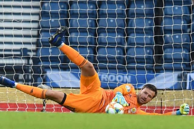 Back for his first cap in almost three years as Steve Clarke's surprise pick over Scott Bain. Kept out efforts from Pieros Sotiriou and Antreas Makris but could do nothing about equaliser.