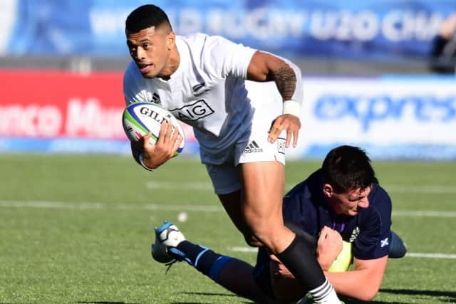 Etene Nanai Seturo of New Zealand is tackled by Will Hurd of Scotland. Picture: Getty Images