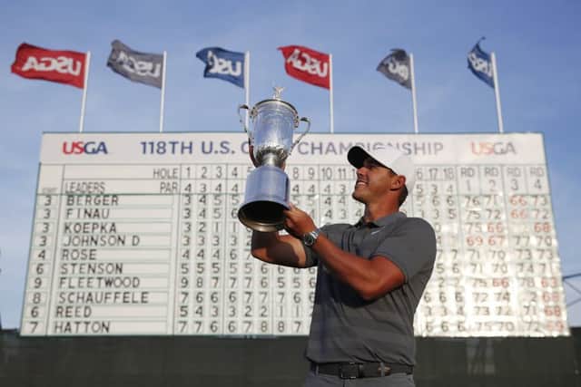 Brooks Koepka with the trophy after winning the 2018 US Open Golf Championship, in Southampton, NY. Picture: AP