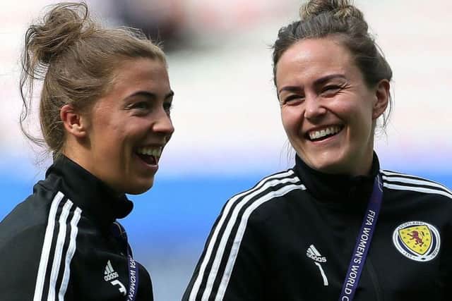 Nicola Docherty and Lee Alexander share a joke ahead of Scotland's World Cup meeting with England
