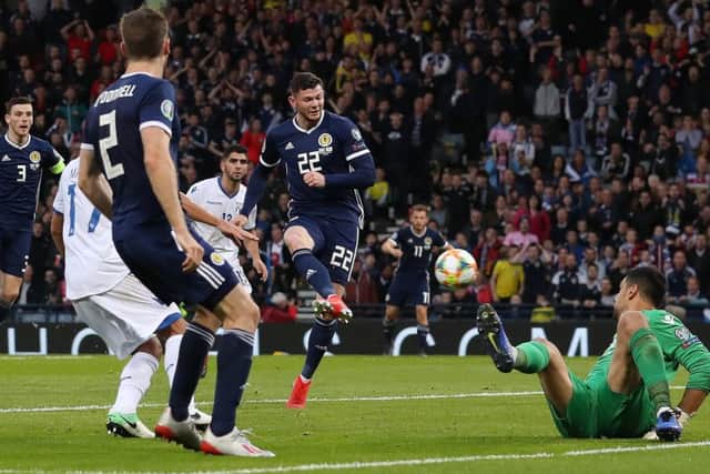 Super-sub Oliver Burke side-foots the ball into the net to give Scotland a 2-1 Euro 2020 qualifying win over Cyprus. Picture: Getty.