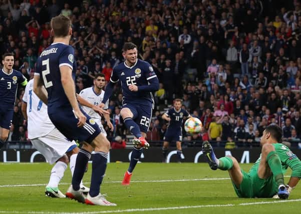 Super-sub Oliver Burke side-foots the ball into the net to give Scotland a 2-1 Euro 2020 qualifying win over Cyprus. Picture: Getty.