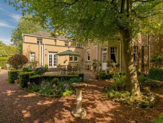 The house comes with three-quarters of an acre of garden. It's a peaceful oasis bordered by mature shrubs and specimen trees and comes with a pond that attracts ducks every year.