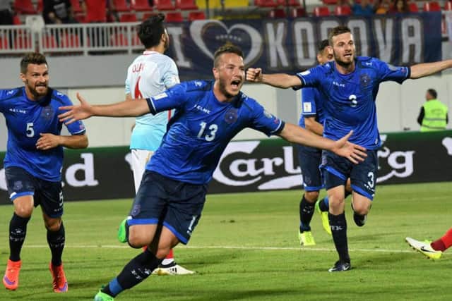 Rrahmani celebrates a goal for Kosovo against Turkey