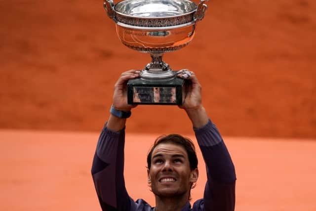 Rafael Nadal hoists the Coupe Des Mousquetaires for the 12th time at Roland Garros on Sunday. Picture: Kenzo Tribouillard/AFP/Getty
