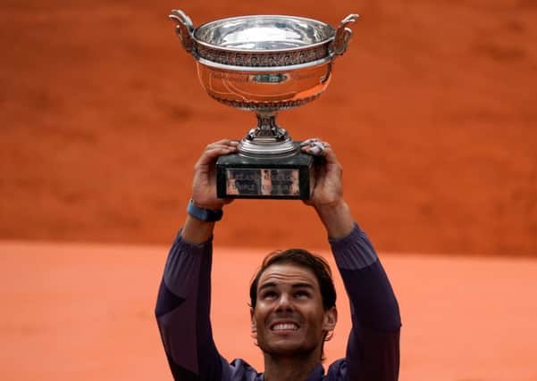Rafael Nadal hoists the Coupe Des Mousquetaires for the 12th time at Roland Garros on Sunday. Picture: Kenzo Tribouillard/AFP/Getty
