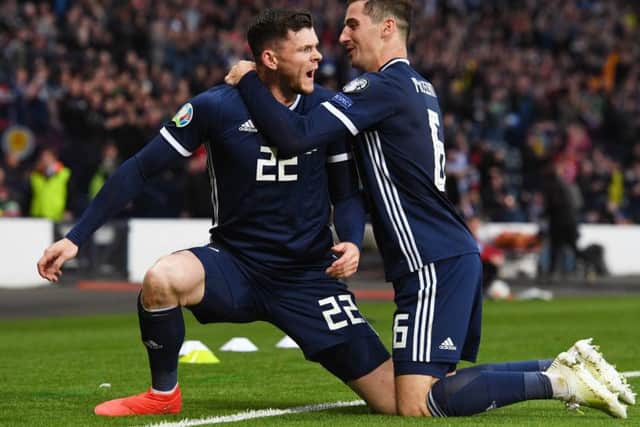 Kenny McLean hugs goal hero Oliver Burke in the win over Cyprus