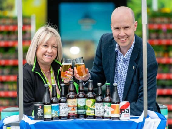 Asda regional trading assistant Yvonne McArthur with Craig Brown, retail sales director at the Craft Beer Clan of Scotland. Picture: Ian Georgeson