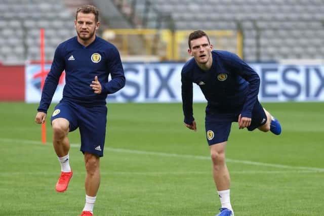 Scotland winger Ryan Fraser, left, and full-back Andy Robertson limber up for a training session at the King Baudouin Stadium. Picture: Virginie Lefour/AFP/Getty Images