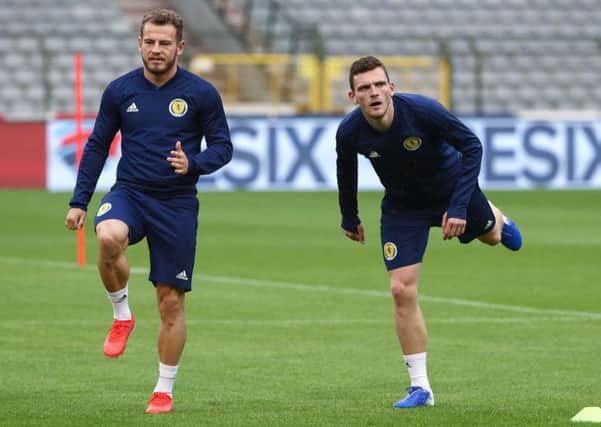 Scotland winger Ryan Fraser, left, and full-back Andy Robertson limber up for a training session at the King Baudouin Stadium. Picture: Virginie Lefour/AFP/Getty Images
