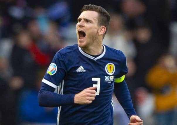 Andy Robertson celebrates opening the scoring for Scotland against Cyprus.
