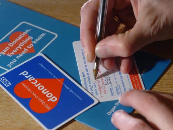 Under current law, donors must opt in for their organs to be donated, with many people carrying a donor card. Picture: JP