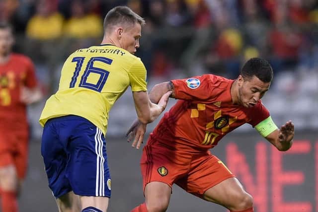 Scotland midfielder Scott McTominay vies for possession with Belgiums Eden Hazard. Picture: John Thys/AFP/Getty Images