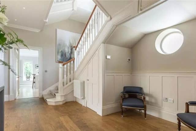 The property has two floors and a modern interior design.