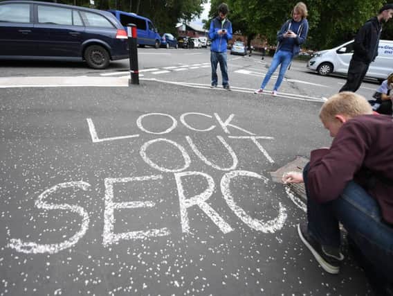 A protest outside a Serco office in Glasgow last year after the company announced its programme of lock-changing properties housing failed asylum seekers