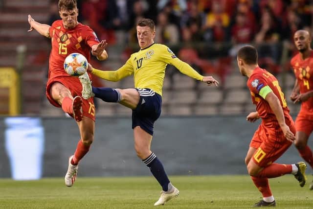 Callum McGregor, centre, in action for Scotland against Belgium. Picture: John Thys/AFP/Getty Images