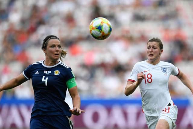 Scotland defender Rachel Corsie (left) vies for the ball with England's Ellen White during their World Cup clash