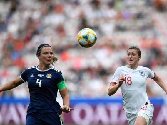 Scotland defender Rachel Corsie (left) vies for the ball with England's Ellen White during their World Cup clash